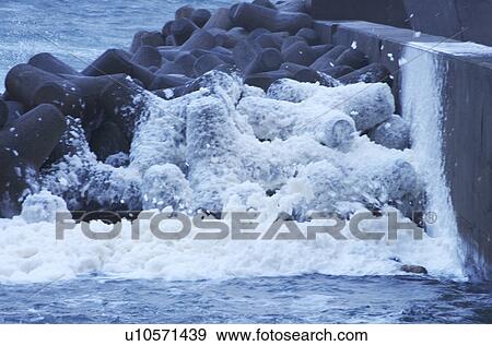 Waves Splashing Against Water Breakers View Large Photo Image Stock Photo - Waves Splashing Against Water Breakers. Fotosearch