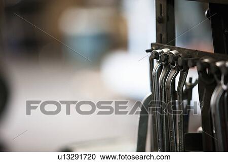Stock Image - Wrenches Hanging. Fotosearch