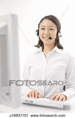 Young businesswoman typing View Large Photo Image Stock Image - Young businesswoman typing. Fotosearch