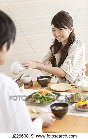 Stock Photo - Young Couple Having Breakfast. Fotosearch
