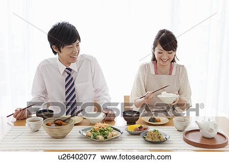 Stock Photo - Young Couple Having Breakfast. Fotosearch