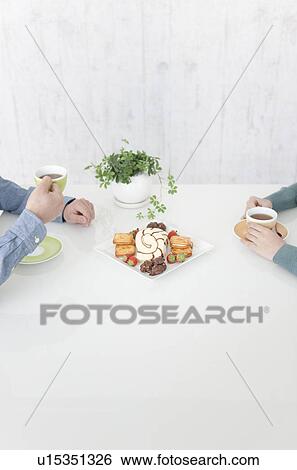 Stock Photograph - Young Couple Having Snack. Fotosearch