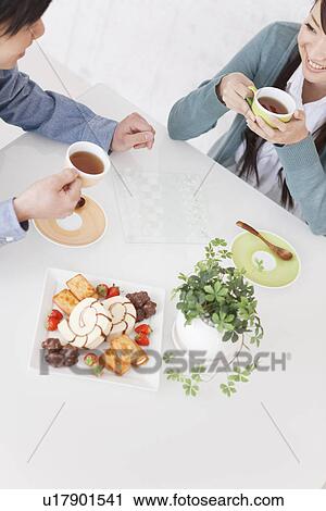 Young Couple Having Tea and Playing Chess View Large Photo Image Stock Image - Young Couple Having Tea and Playing Chess. Fotosearch