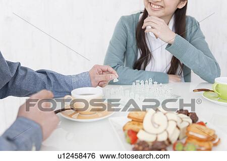 Young Couple Having Tea and Playing Chess View Large Photo Image Stock Photograph - Young Couple Having Tea and Playing Chess. Fotosearch