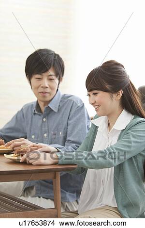 Young Couple Having Tea and Snack View Large Photo Image Picture - Young Couple Having Tea and Snack. Fotosearch