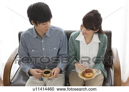 Young Couple Having Tea and Snack View Large Photo Image Stock Image - Young Couple Having Tea and Snack. Fotosearch