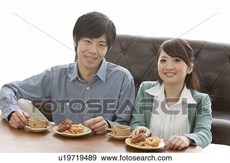 Young Couple Having Tea and Snack View Large Photo Image Stock Photo - Young Couple Having Tea and Snack. Fotosearch