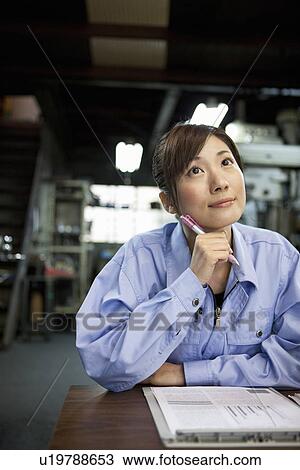 Young Female Factory Worker Thinking View Large Photo Image Stock Image - Young Female Factory Worker Thinking. Fotosearch