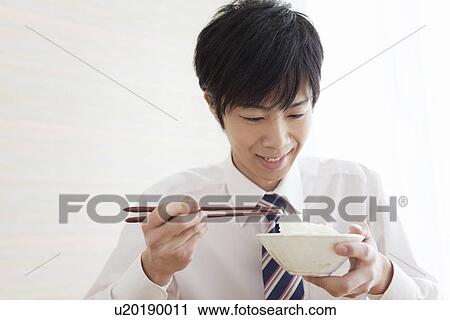 Young Man Eating Boiled Rice For Breakfast View Large Photo Image Stock Image - Young Man Eating Boiled Rice For Breakfast. Fotosearch