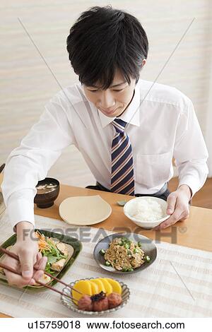 Young Man Eating Breakfast View Large Photo Image Stock Photo - Young Man Eating Breakfast. Fotosearch