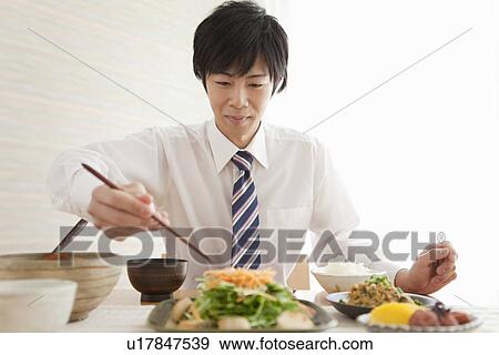Young Man Eating Breakfast View Large Photo Image Stock Photo - Young Man Eating Breakfast. Fotosearch
