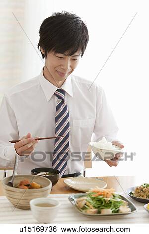 Young Man Eating Breakfast View Large Photo Image Stock Photograph - Young Man Eating Breakfast. Fotosearch