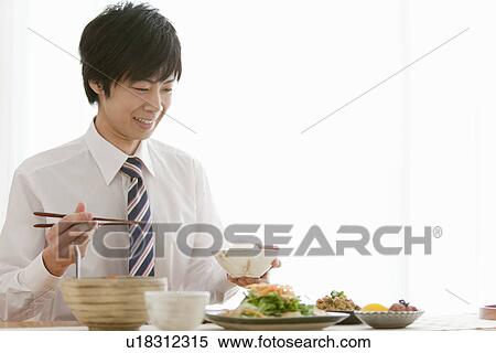 Young Man Eating Breakfast View Large Photo Image Stock Photography - Young Man Eating Breakfast. Fotosearch