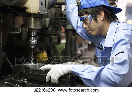 Young Man Using Industrial Drill View Large Photo Image Stock Image - Young Man Using Industrial Drill. Fotosearch