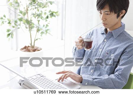 Young Man Using Laptop View Large Photo Image Stock Photo - Young Man Using Laptop. Fotosearch