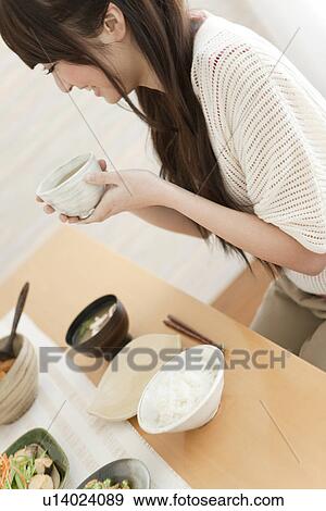 Young Woman Drinking Tea at Breakfast Table View Large Photo Image Stock Photo - Young Woman Drinking Tea at Breakfast Table. Fotosearch