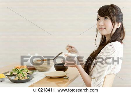 Young Woman Eating Breakfast View Large Photo Image Stock Image - Young Woman Eating Breakfast. Fotosearch