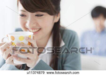 Stock Photo - Young Woman Having Tea. Fotosearch