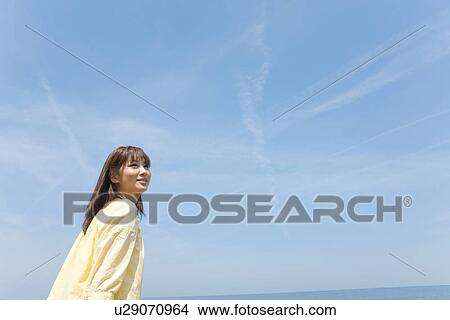 Young Woman on Beach View Large Photo Image Picture - Young Woman on Beach. Fotosearch