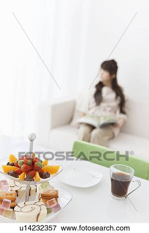 Young Woman Reading Magazine View Large Photo Image Stock Photo - Young Woman Reading Magazine. Fotosearch
