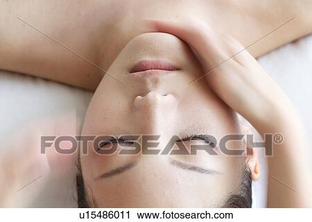 Young Woman Receiving Facial Massage, Close-Up View Large Photo Image Stock Image - Young Woman Receiving Facial Massage, Close-Up. Fotosearch