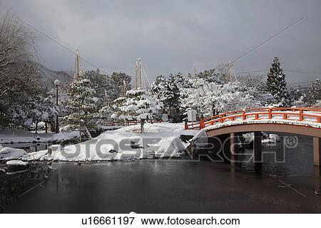 Stock Photo - Yukitsuri in Murasakishikibu park. Fotosearch