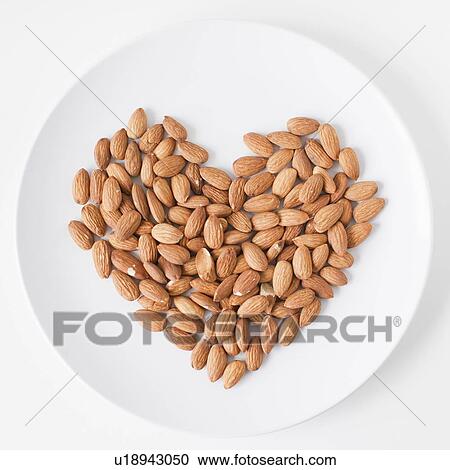 Almonds heart on plate, studio shot View Large Photo Image Stock Image - Almonds heart on plate, studio shot. Fotosearch