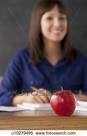 Apple on teacher's desk View Large Photo Image Stock Photography - Apple on teacher's desk. Fotosearch