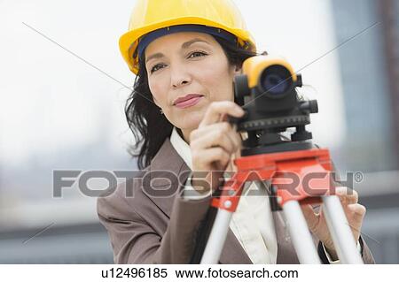 Stock Photography - Architect using theodolite. Fotosearch