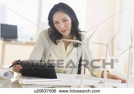 Stock Photograph - Architect working in office. Fotosearch