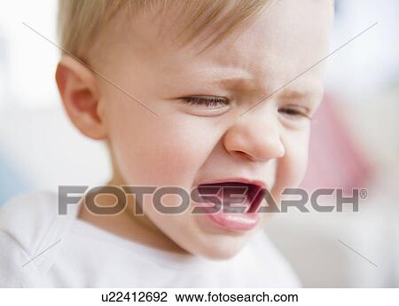 Baby boy (6-11 months) crying View Large Photo Image Stock Image - Baby boy (6-11 months) crying. Fotosearch