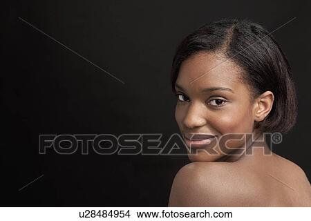 Beautiful young woman looking at camera View Large Photo Image Picture - Beautiful young woman looking at camera. Fotosearch