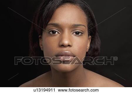Beautiful young woman looking at camera View Large Photo Image Stock Image - Beautiful young woman looking at camera. Fotosearch
