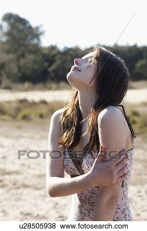 Belgium, Kalmthoutse Heide, Portrait of young woman View Large Photo Image Stock Photo - Belgium, Kalmthoutse Heide, Portrait of young woman. Fotosearch