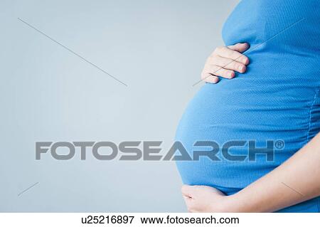 Belly of pregnant woman View Large Photo Image Stock Photo - Belly of pregnant woman. Fotosearch