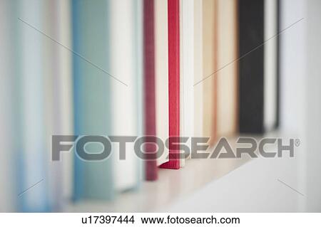 Picture - Books on shelf. Fotosearch