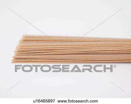 Stock Photo - Bunch of dried spaghetti, close-up. Fotosearch