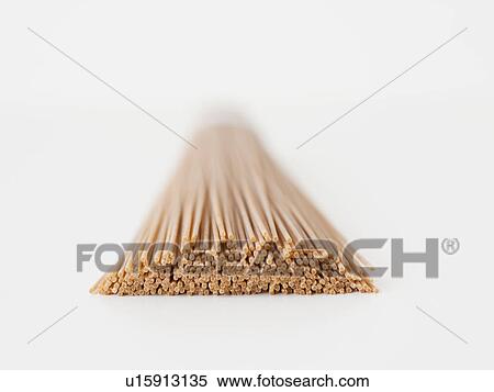 Bunch of dried spaghetti, close-up View Large Photo Image Stock Photography - Bunch of dried spaghetti, close-up. Fotosearch
