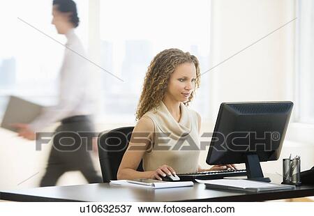 Business woman working in office View Large Photo Image Stock Photo - Business woman working in office. Fotosearch