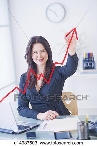 Businesswoman drawing graph View Large Photo Image Stock Image - Businesswoman drawing graph. Fotosearch