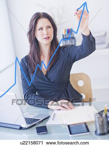 Businesswoman drawing graph View Large Photo Image Stock Image - Businesswoman drawing graph. Fotosearch