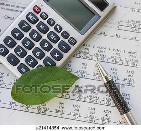 Calculator with spreadsheet and green leaf View Large Photo Image Picture - Calculator with spreadsheet and green leaf. Fotosearch
