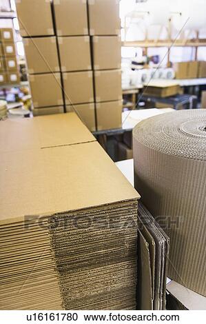 Cardboard for boxes in warehouse View Large Photo Image Stock Image - Cardboard for boxes in warehouse. Fotosearch