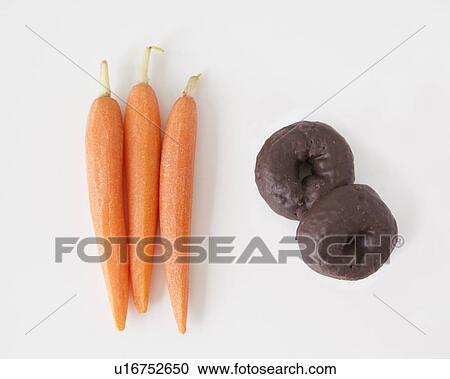 Carrots and chocolate cookies on white background, studio shot View Large Photo Image Stock Image - Carrots and chocolate cookies on white background, studio shot. Fotosearch