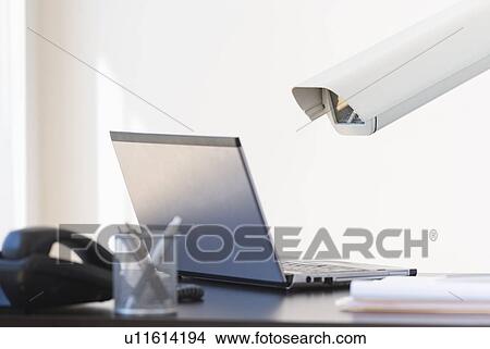 Cctv camera over laptop View Large Photo Image Picture - Cctv camera over laptop. Fotosearch