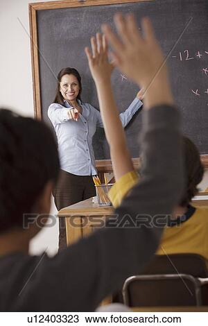 Stock Image - Children (10-11, 12-13) at school. Fotosearch