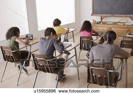 Stock Photograph - Children (10-11, 12-13) at school. Fotosearch