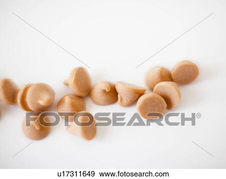 Stock Photo - Chocolate sweets on white background, studio shot. Fotosearch