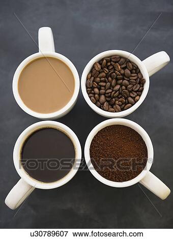 Close up coffee cups with coffee and roast coffee beans View Large Photo Image Stock Photo - Close up coffee cups with coffee and roast coffee beans. Fotosearch