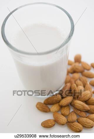 Close up of almond milk and almonds View Large Photo Image Stock Photo - Close up of almond milk and almonds. Fotosearch